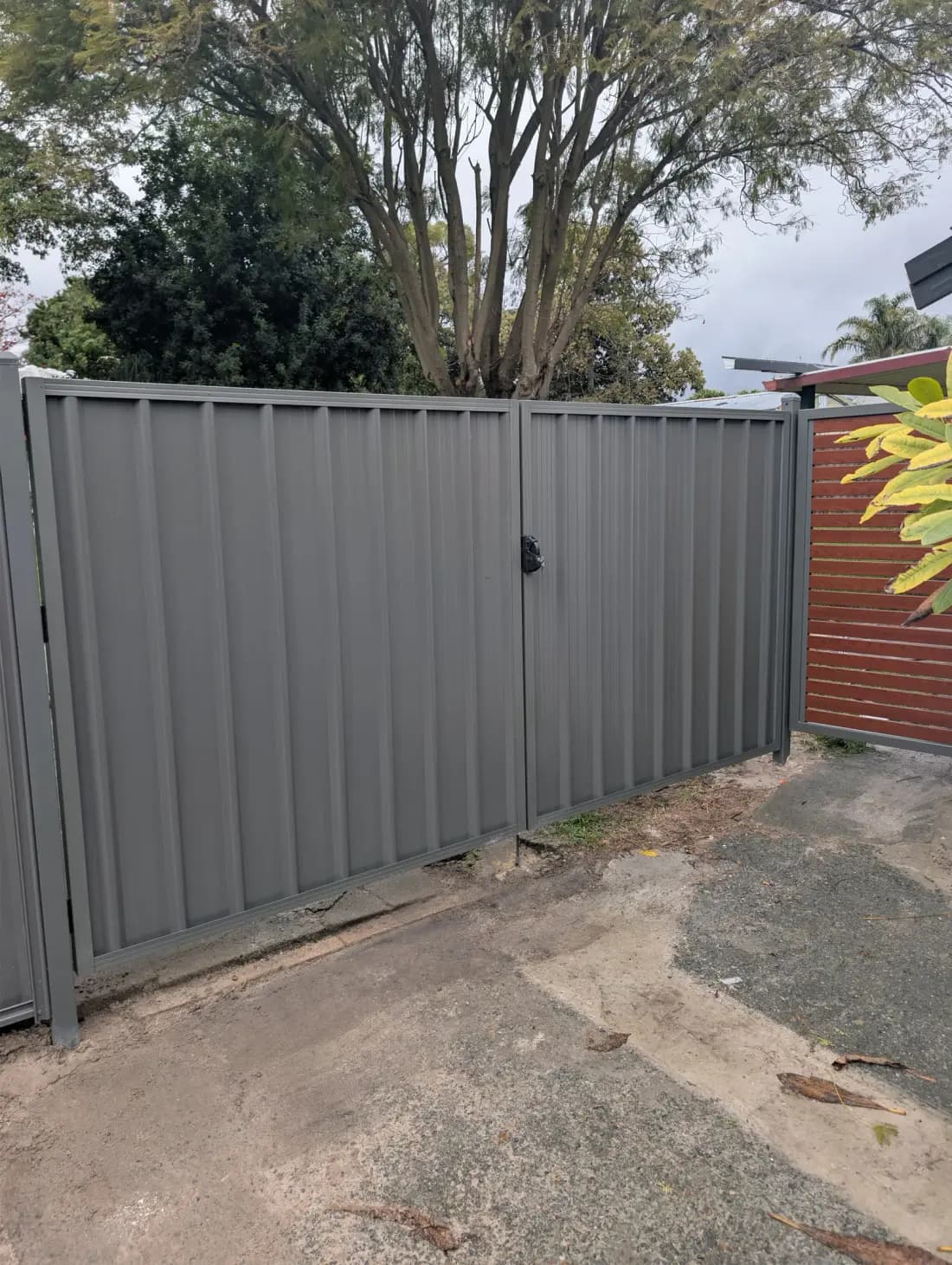 A grey Colorbond fence and gate